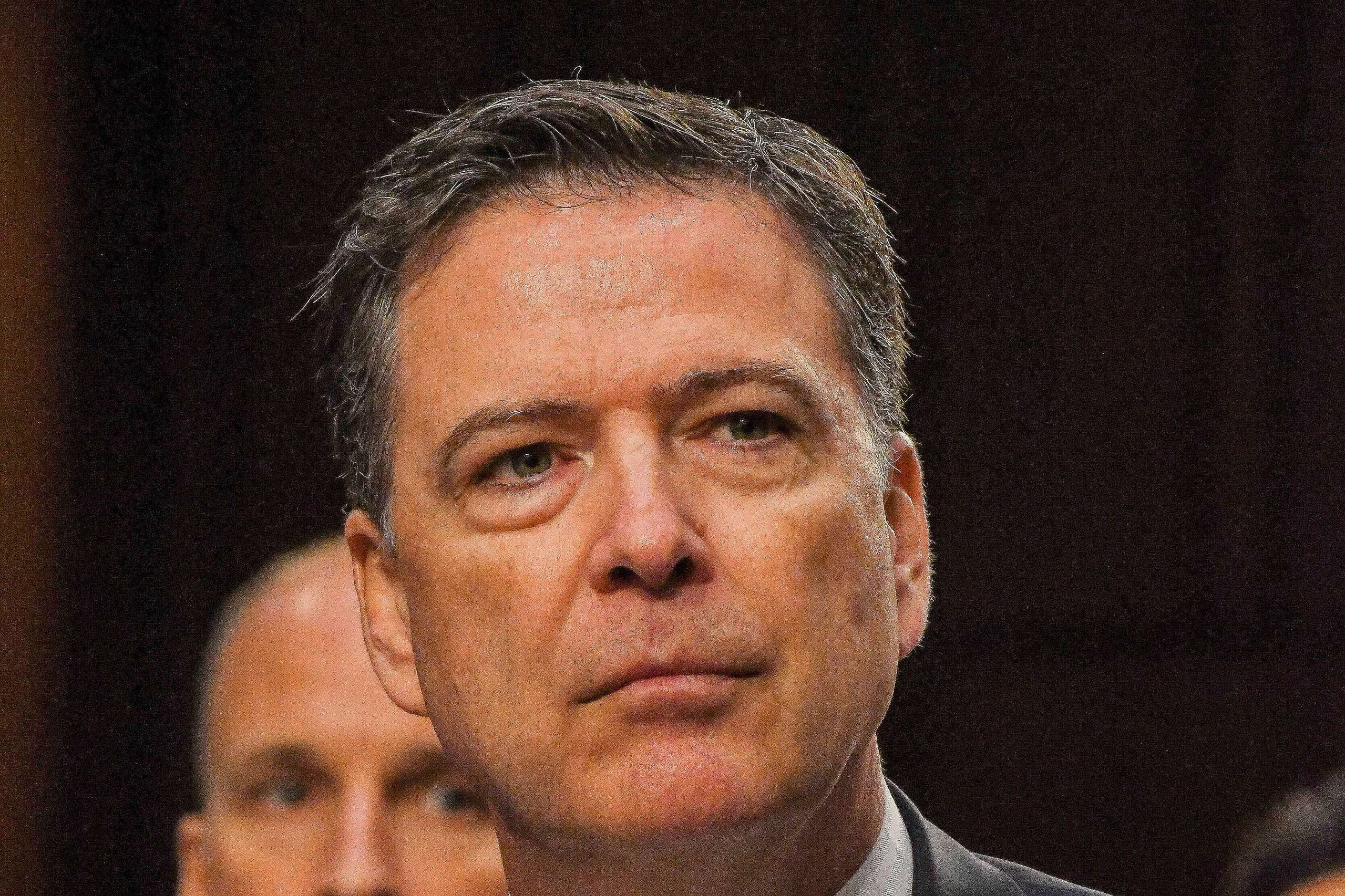 Article image for Comey declares innocence after court appearance on charges he threatened Trump